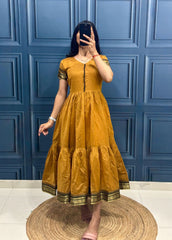 Vibrant Green Tiered Dress with Traditional Border