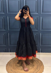 Vibrant Green Tiered Dress with Traditional Border